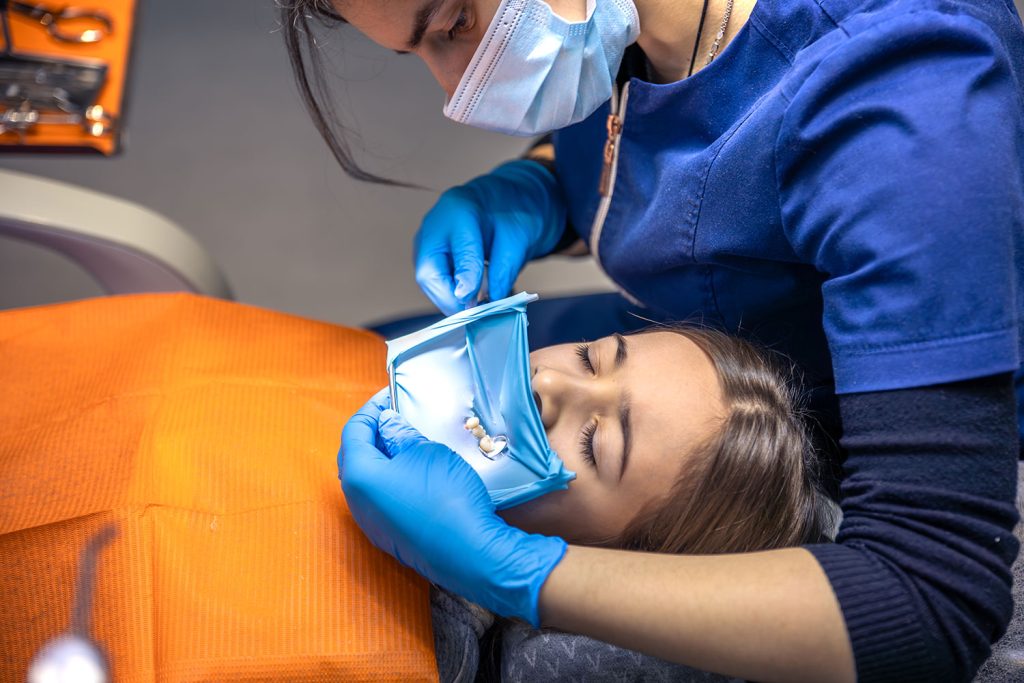 Patient relaxing under dental sedation at Six Ways Dental